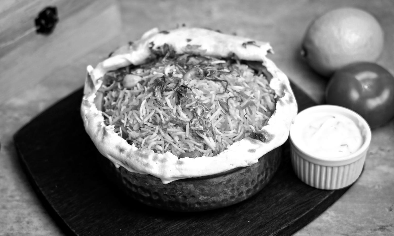 Professional kitchen workspace demonstrating gourmet cooking techniques